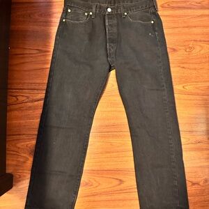 Used Black Levi’s 501 Jeans, have one small stain on the left pocket side